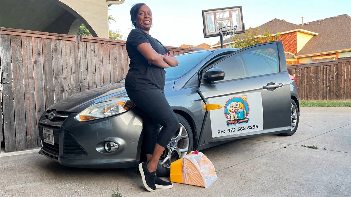 Dee beside the Poop Savvy gray service car